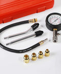 Flat-lay 8-piece engine compression tester kit with gauge, hoses and brass adapters in red case