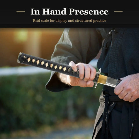 Aluminum Iaido Wakizashi Practice Sword With 21 Inch Blade For Safe Nukitsuke And Noto Drills held by practitioner in training