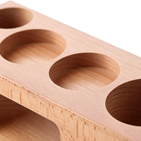 Buttery Smooth Espresso Tamper Station Crafted From Solid Natural Wood 58mm with circular cutouts for tool storage.