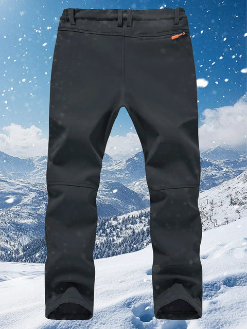 Men's Ski Waterproof Insulated Softshell Snow Pants With Fleece Lining And Zipper Pockets For Snowboarding And Outdoor Winter Activities Dark Gray 42W By 32L on snowy mountain background.