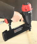 Pro Grade 16 Gauge Pneumatic Straight Finish Nailer With Tool Free Depth Adjustment being used on wood surface
