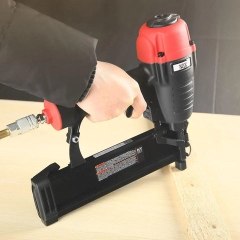 Pro Grade 16 Gauge Pneumatic Straight Finish Nailer With Tool Free Depth Adjustment being used on wood surface