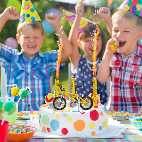 Kids at a birthday party with 12 Pack Mini Finger BMX Bikes For Kids And Adults, Reconfigurable Tiny Bicycle Toys, on a cake.