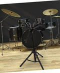 No Fuss Foldable Alloy Snare Drum Stand, Rock Solid Lightweight Percussion Tripod Rack with Adjustable Height in practice space.