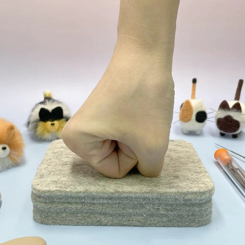 Hand pressing wool felting pad from Beginner Friendly Needle Felting Kit For Adults Who Love Getting Crafty With All In One DIY Craft Supplies