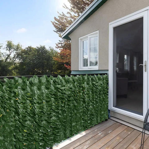 Artificial Ivy Privacy Screen For Fence 39 Inch High 118 Inch Long next to patio door, outdoor setting with greenery.