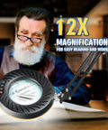 12X Magnifying Glass With Light And Stand For Crafts And Reading, 4.3 Inch HD Lens in use by a man reading a book, desktop setup