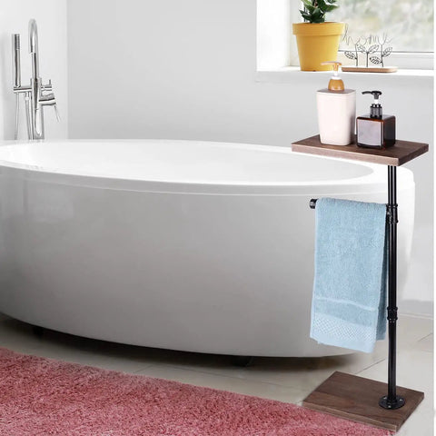 Dark Brown Toilet Paper Holder Stand For Bathroom with shelf, towel, and decor beside white bathtub in bright setting.