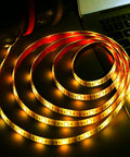 Battery Powered LED Strip Lights With 24 Key Remote For DIY Indoor And Outdoor Decor And Accent Lighting Waterproof Six Point Five Six Foot Long Flexible Tape glowing on surface
