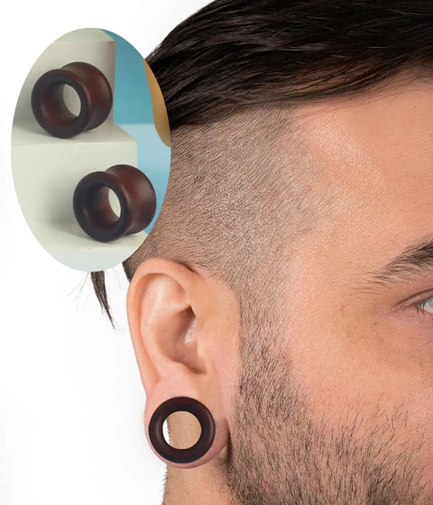 Close-up of person wearing Three Pairs Organic Wood Ear Plugs Set With Double Flared Ear Tunnels Saddle Fit Wooden Gauges Five Eighths Inch 16mm Natural Black Brown Tones Perfect For Punk Piercing And Everyday Wear