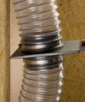 Close-up of StableGate With Bracket Dust Gate, Two And A Half Inch, connecting clear hose in a wall-mounted setup, showing easy operation.