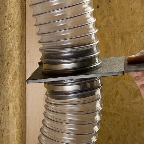 Close-up of StableGate With Bracket Dust Gate, Two And A Half Inch, connecting clear hose in a wall-mounted setup, showing easy operation.