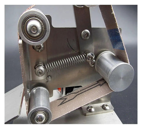 Close-up of Compact Mini Electric Belt Sander And Multifunctional Desktop Grinder raw material with high-speed motor components.