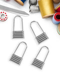Heavy Duty Metal Zipper Pull Tabs For Backpack Repair Silver Replacement Sliders on a crafting background with threads.