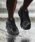 Waterproof Silicone Shoe Covers Overshoes With Non Slip Grip For Men Women Kids on feet splashing in water.