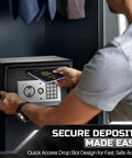 Man using Drop Slot Money Safe Box With Digital Keypad Lock in cabinet, depositing passport, black exterior, easy access
