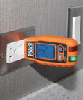 RT250 GFCI Outlet Tester With LCD Display inserted into 120V wall receptacle showing voltage on backlit screen