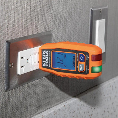 RT250 GFCI Outlet Tester With LCD Display inserted into 120V wall receptacle showing voltage on backlit screen