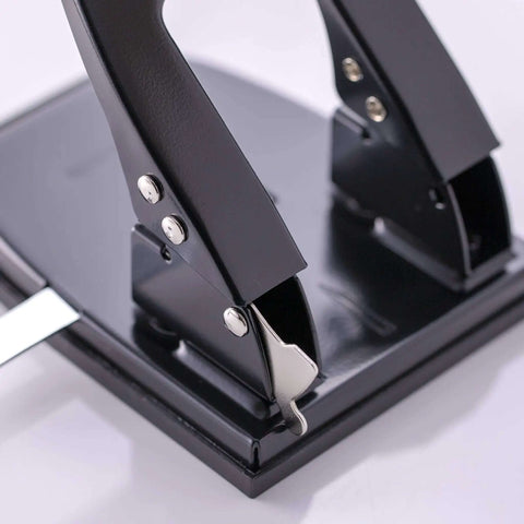Close-up of the Workhorse Two Hole Puncher for Paper with 30 Sheet Capacity Adjustable Guide and Locking Mechanism