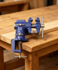 Heavy Duty Woodworking Bench Clamp With 360 Rotation For Pros, High Carbon Steel Vise mounted on wooden table.