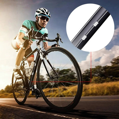 Cyclist on road bike with Premium 4-Piece Bike Brake Cable Set, Universal Standard Front And Rear Cables, 2M Length.
