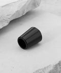 Close-up of single 0.335 inch golf club shaft ferrule, black, for Titleist GT TSi TSR TS 1 2 3 4 and 910 913 driver models, 16mm long.