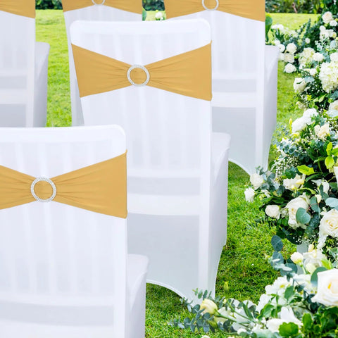 Gold spandex chair sash with rhinestone ring slider on a white banquet chair outdoors