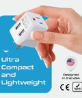 Hand holding Ultra Compact USA To Type I Travel Adapter With Dual USB Input For Australia New Zealand And China Perfect For Cell Phones Chargers Cameras And More 10-15A 250V Safe.