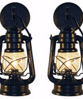 Rustic Oil Lantern Reproduction Wall Sconce Set With Rustic Powder Coat Finish displaying two lanterns with clear glass bulbs