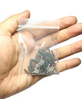 Built Tough Precision Ground 2mm X 10mm Dowel Pins 60 Pack in hand, showcasing stainless steel cylinder rods for wood projects.