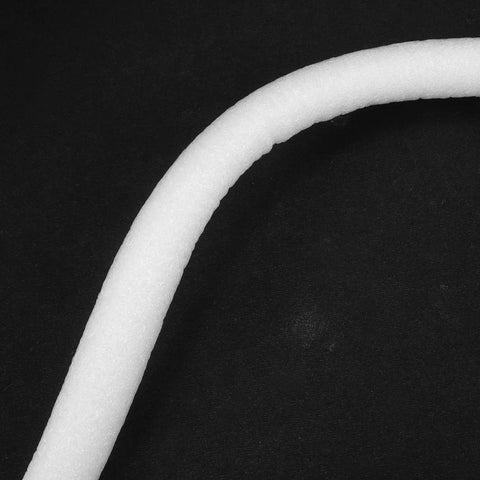 Heavy Duty Foam Caulk Saver Strip for Concrete Gaps and Wall Joints showing white closed cell foam strip on black surface.