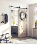 Heavy Duty Sliding Barn Door Hardware Kit For 30 Inch Wide Door Panel Black Finish With J Shape Hangers installed in living room