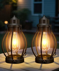 Two Pack Battery Powered LED Lanterns With Dimmerable Warm White Edison Bulbs Vintage Oil Lantern Look Waterproof Hanging Table Lamps For Camping Outdoor And Indoor Decor on patio table
