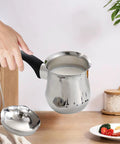 Turkish Coffee Pot And Butter Warmer Pan Stainless Steel 720ml with handle, used for coffee or melting, on kitchen counter.