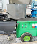Portable Cement Mortar Spray Machine Wall Plaster Sprayer High Efficiency Sand Render Pump For Construction Home And Office Projects Easy To Use And Durable Tool in green and grey color with wheels and hopper.