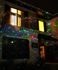 Outdoor Christmas RGB Laser Light Projector With 8 Patterns In 1 illuminating a house facade at night, garden decor