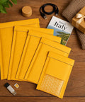 6x9 Inch Bubble Mailers 25 Pack Self Seal Padded Envelopes Kraft for Accessories and Lightweight Clothing shown on wooden table