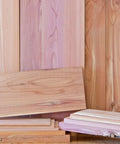 Snag These Ridiculously Smooth Three Quarter By Five By Twenty Four Inch Aromatic Cedar Hardwood Planks stacked and displayed.