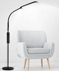 LED Floor Lamp With Remote, Dimmable 2000K-6500K, 9 Brightness Levels next to a modern armchair in a living room.