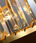 Close-up of BUNCC Modern Minimalist Metal Wall Sconce, E14 LED Crystal accents reflecting light.