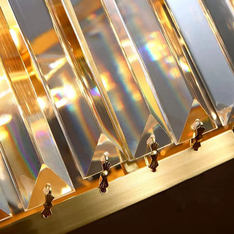 Close-up of BUNCC Modern Minimalist Metal Wall Sconce, E14 LED Crystal accents reflecting light.