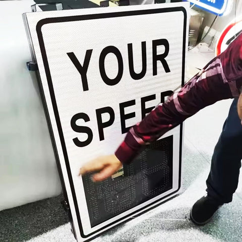 Person pointing to Solar Powered Radar Speed Sign With Real Time Speed Display For Highways And Speed Limited Roads, Wireless Setup