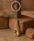 Adjustable Wrench Keychain For Women With Realistic Copper Color Mini Tool Charm on rustic background