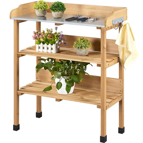 Outdoor Garden Potting Bench With Metal Top Storage Shelf And Three Hooks Durable Fir Wood Workstation displayed with plants and tools