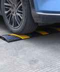 Heavy Duty Rubber Speed Bump 6 Foot Ramp With Integrated Cable Cover 72 Inch Long One Piece Installation under car tire
