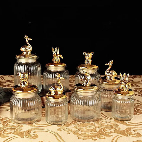 Dead Legit Glass Kitchen Storage Jars With Snap On Lids, assorted sizes, clear glass, decorative animal topped lids.