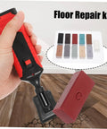 Hand holding Floor Repair Kit With Quick Heating Wax Block Sponge For Laminate And Hardwood Floors And Tile Scratches Easy To Use Home Damage Fix Durable Tool For Home Renovation And Quick Restore on wood floor