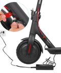 Universal 42V 2A Electric Scooter Charger with 71W Max Output connected to scooter showing charging setup