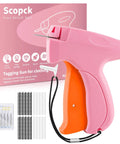 Pink and orange handheld stitch gun with packaging, includes 6 needles and 2000 fasteners, Handheld Stitch Gun For Quick Clothing Fixes With Invisible 5mm Needle, No Sew Friendly, Includes 6 Needles And 1000 Black And 1000 White Fasteners For Easy Hemming, Repairs, And Tagging.
