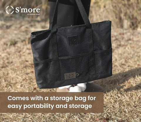 Portable Camping Fire Pit With Grill For Cooking, Outdoor Stove With Storage Bag shown carried on grassy background